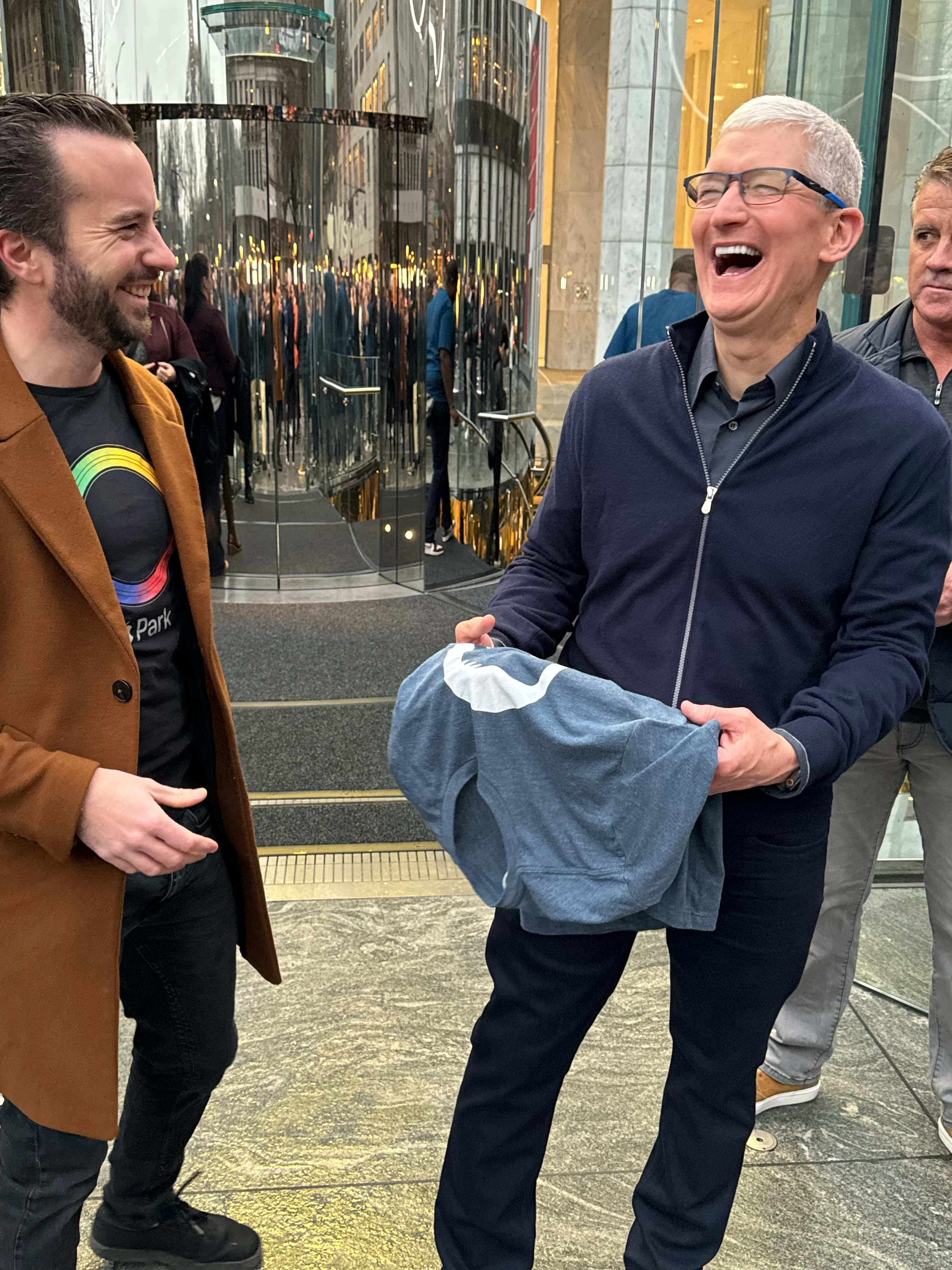 Tim Cook accepting the t-shirt